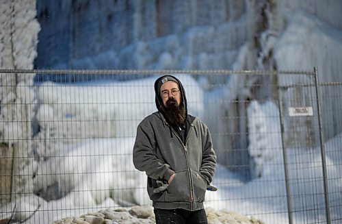 JESSICA LEE / WINNIPEG FREE PRESS

Chris Sawatzky, a guitarist who rented a practice space in the basement of the Kirkwood block, poses for a photo on February 9, 2022. The building is covered with ice from the water the firefighters used to put out the fire on February 2, 2022.

Reporter: Ben







