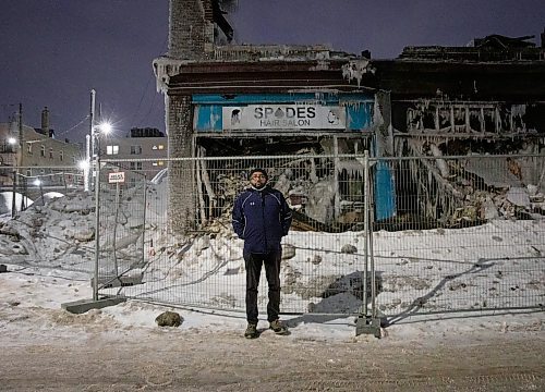 JESSICA LEE / WINNIPEG FREE PRESS

Yared Teklezigi poses for a photo on February 9, 2022 outside of the salon and nightclub he owned.The building that housed the salon and nightclub was damaged by a fire on February 2, 2022. The building is covered with ice from the water the firefighters used to put out the flames.

Reporter: Ben








