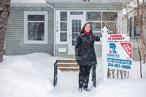 MIKAELA MACKENZIE / WINNIPEG FREE PRESS

Ren&#xe9;e Robidoux Kapitoler, real estate agent, poses for a portrait in front of a house that will be coming on the market soon in Winnipeg on Thursday, Feb. 10, 2022. She&#x2019;s never seen the housing market as crazy in January/February than this year (and maybe last). For Gabby Piche story.
Winnipeg Free Press 2022.