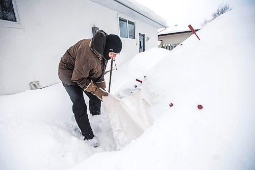 MIKAELA MACKENZIE / WINNIPEG FREE PRESS

Alex Wiebe, who loves embracing the winter elements, poses for a portrait by his backyard quinzhee in Winnipeg on Thursday, Feb. 10, 2022. . For Declan story.
Winnipeg Free Press 2022.