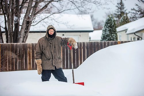 MIKAELA MACKENZIE / WINNIPEG FREE PRESS

Alex Wiebe, who loves embracing the winter elements, poses for a portrait by his backyard quinzhee in Winnipeg on Thursday, Feb. 10, 2022. . For Declan story.
Winnipeg Free Press 2022.