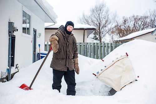 MIKAELA MACKENZIE / WINNIPEG FREE PRESS

Alex Wiebe, who loves embracing the winter elements, poses for a portrait by his backyard quinzhee in Winnipeg on Thursday, Feb. 10, 2022. . For Declan story.
Winnipeg Free Press 2022.