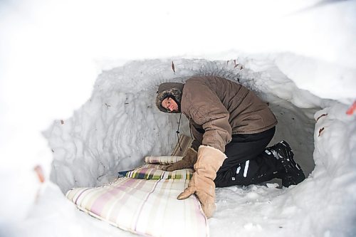 MIKAELA MACKENZIE / WINNIPEG FREE PRESS

Alex Wiebe, who loves embracing the winter elements, poses for a portrait in his backyard quinzhee in Winnipeg on Thursday, Feb. 10, 2022. . For Declan story.
Winnipeg Free Press 2022.