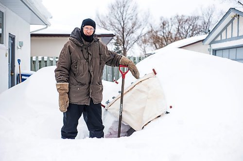 MIKAELA MACKENZIE / WINNIPEG FREE PRESS

Alex Wiebe, who loves embracing the winter elements, poses for a portrait by his backyard quinzhee in Winnipeg on Thursday, Feb. 10, 2022. . For Declan story.
Winnipeg Free Press 2022.