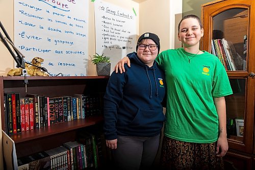 Katimavik participants Hannah Lyon, left, and Meaghan Foster stand in the living room of their programs house Friday. (Chelsea Kemp/The Brandon Sun)