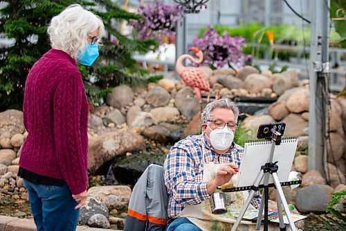 Painters Linda Tame, left, and Roger Conrad participate in a painting demonstration at the Green Spot Home and Garden Saturday. The Artist Heart Friends will be hosting demonstrations at the garden centre the third Saturday of each month. (Chelsea Kemp/The Brandon Sun)