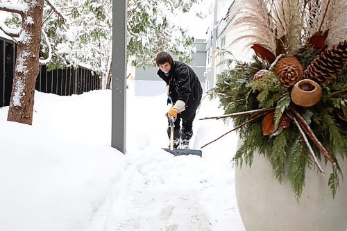 RUTH BONNEVILLE / WINNIPEG FREE PRESS

LOCAL - snow plows

Russal Sand (employee that has been working with Mark for 9 years), clears the sidewalks of snow. 

Story on a local snow plow team, Mark's River Heights Lawn Services. Feature on their day to day activities.  

Photos of the owner, Mark Riddell, working shots of staff and two customer's. 

Malak Abas
Reporter | Winnipeg Free Press

Feb 10,  2022