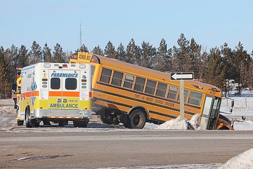 11022022
Emergency workers attend to a two-vehicle collision involving a school bus on the Trans Canada Highway and Harrison Bridge Road on Friday afternoon. No one was seriously injured in the collision. (Tim Smith/The Brandon Sun)