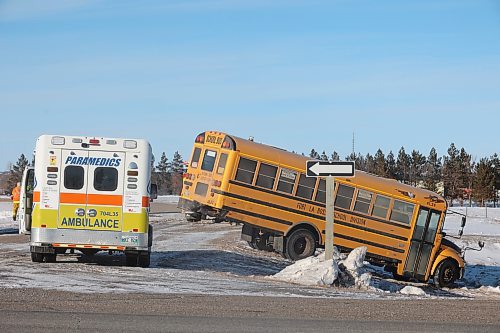 11022022
Emergency workers attend to a two-vehicle collision involving a school bus on the Trans Canada Highway and Harrison Bridge Road on Friday afternoon. No one was seriously injured in the collision. (Tim Smith/The Brandon Sun)