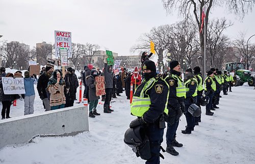 David Lipnowski / Winnipeg Free Press

Winnipeg police officers separate counter protesters across the street from the downtown freedom rally protesters Saturday February 12, 2022.