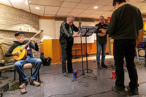 Daniel Crump / Winnipeg Free Press. Fred Dugdale, of the Celtic band Killick, and his bandmates prepare for a set at the Irish Association of Manitoba club in Winnipeg. February 12, 2022.