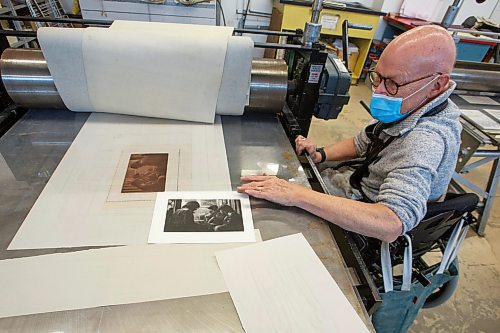 MIKE DEAL / WINNIPEG FREE PRESS
Ted Howorth is a printmaker and wheelchair user who was involved in the consultation process for an arts venue audit created by the Arts Accessibility Network Manitoba. The audit aims to give venue operators ways to make their space more accessible for patrons and artists with disabilities.
At the Martha Street Studio, Ted, works on printing one of his mezzotint plates Monday afternoon. The printing studio is in the basement of the building and requires him to use an elevator to gain access. The majority of the equipment is already somewhat accessible to him with only the odd item that is requires a bit more effort to access.
See Eva Wasney story
220214 - Monday, February 14, 2022.