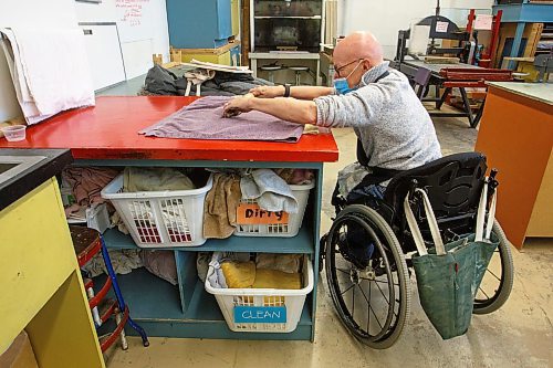 MIKE DEAL / WINNIPEG FREE PRESS
Ted Howorth is a printmaker and wheelchair user who was involved in the consultation process for an arts venue audit created by the Arts Accessibility Network Manitoba. The audit aims to give venue operators ways to make their space more accessible for patrons and artists with disabilities.
At the Martha Street Studio, Ted, works on printing one of his mezzotint plates Monday afternoon. The printing studio is in the basement of the building and requires him to use an elevator to gain access. The majority of the equipment is already somewhat accessible to him with only the odd item that is requires a bit more effort to access.
See Eva Wasney story
220214 - Monday, February 14, 2022.