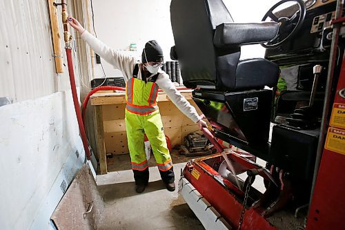 JOHN WOODS / WINNIPEG FREE PRESS
Taylor Brandt, recreation facility operator at East St Paul Community Centre, prepares the ice resurfacer in the indoor rink at the community centre Monday, February 14, 2022. Brandt has been driving an ice resurfacer for the past year. Brandt also does landscaping at the centre during the summer months.

Re: Small