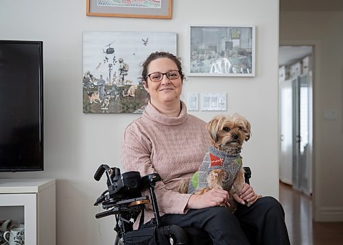 JESSICA LEE / WINNIPEG FREE PRESS

Yvette Cenerini, a digital collage maker and a wheelchair user, is photographed at her home in front of her two pieces with her dog Jasper on February 15, 2022, in St. Boniface.

Reporter: Eva