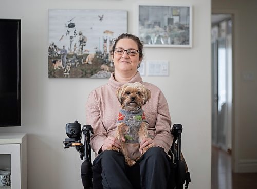 JESSICA LEE / WINNIPEG FREE PRESS

Yvette Cenerini, a digital collage maker and a wheelchair user, is photographed at her home in front of her two pieces with her dog Jasper on February 15, 2022, in St. Boniface.

Reporter: Eva