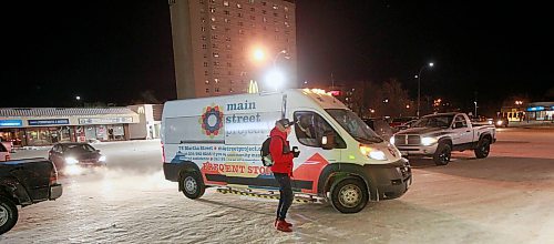 PHIL HOSSACK / WINNIPEG FREE PRESS - A man living on the streets cradles a hot coffee in his hands beside the MSP Outreach Van Thursday night. January 31, 2019