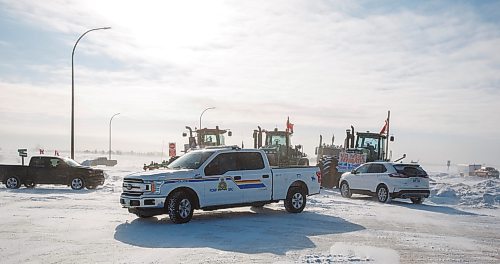 MIKE DEAL / WINNIPEG FREE PRESS
RCMP move their vehicles into positions prior to the press conference as trucks continue blocking the border crossing at Emerson, MB.
220216 - Wednesday, February 16, 2022.