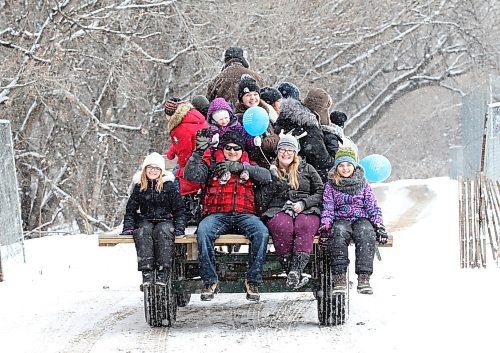 RUTH BONNEVILLE / WINNIPEG FREE PRESS



People of all ages enjoy a horse-drawn hey ride with Bar 32 Horse Drawn Ventures Inc. along the Red River  at the Festival du Voyageur site in the light falling snow Saturday

site 

Feb 25, 2017
