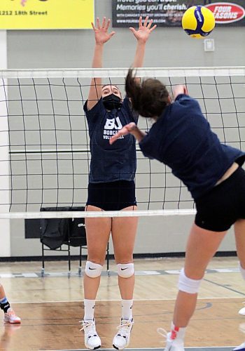 Danielle Dardis goes up to block an attack during Brandon University women's volleyball practice at the Healthy Living Centre on Tuesday. (Thomas Friesen/The Brandon Sun)