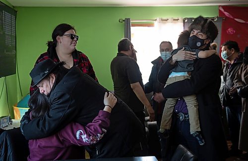 JESSICA LEE / WINNIPEG FREE PRESS

MKO Grand Chief Garrison Settee, who is from Pimicikamak Cree Nation, (right) and Grand Chief Arlen Dumas hug relatives of the North family at the grandfather&#x2019;s house of the North children on February 16, 2022 at Cross Lake. A fire occurred on February 12, 2022 at the North residence and took the lives of three children: Kolby North, 17, Jade North, 13 and Reid North, 3.

Reporter: Danielle