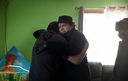 JESSICA LEE / WINNIPEG FREE PRESS

MKO Grand Chief Garrison Settee, who is from Pimicikamak Cree Nation, hugs a relative of the family affected at the grandfather&#x2019;s house of the North children on February 16, 2022 at Cross Lake. A fire occurred on February 12, 2022 at the North residence and took the lives of three children: Kolby North, 17, Jade North, 13 and Reid North, 3.

Reporter: Danielle