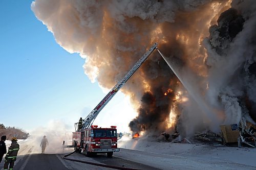 17022022
Brandon Fire and Emergency Services members battle a large fire that destroyed an apartment complex under construction on Victoria Avenue and 42nd Street in Brandon on a bitterly cold Thursday morning. Smoke from the blaze could be seen from across the city as it towered up into the clear sky. (Tim Smith/The Brandon Sun)