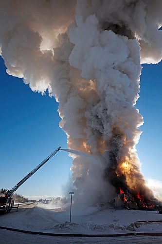 17022022
Brandon Fire and Emergency Services members battle a large fire that destroyed an apartment complex under construction on Victoria Avenue and 42nd Street in Brandon on a bitterly cold Thursday morning. Smoke from the blaze could be seen from across the city as it towered up into the clear sky. (Tim Smith/The Brandon Sun)