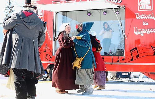 RUTH BONNEVILLE / WINNIPEG FREE PRESS

 LOCAL / ENT - FdV

Musicians play inside the music box as members of the official festival family, THE TURENNE FAMILY, dance in front of it during the launch of the 2022 festival on Thursday. 

The Festival du Voyageur unveils its Music Box, the Boite de chansons at Whittier Park. At the festival kickoff presser, musicians played inside the music box, which is a trailer that has a band inside separated by glass, to perform for the audience outside. It's partially a COVID-19 protection shield, but also helps when it's cold because band can have electronic difficulty in cold weather. 

See Small story. 

Feb 17th, 2022