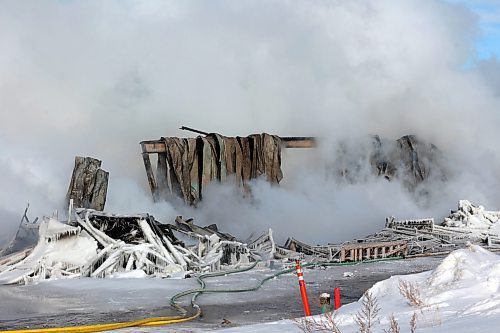 17022022
Firefighters continued to douse hot spots at an under-construction apartment complex on Victoria Avenue at 42nd St. late Thursday afternoon after the build burned to the ground Thursday morning. (Tim Smith/The Brandon Sun)