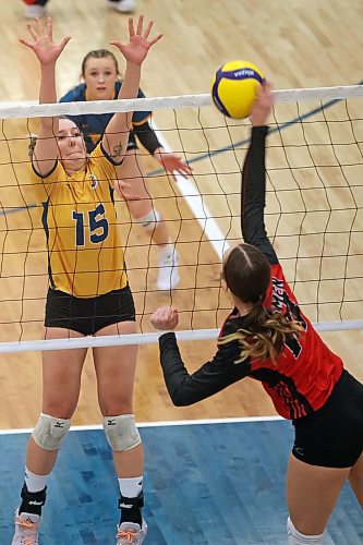 17022022
Nicole Ashauer of the Brandon University Bobcats leaps to block the ball during university women's volleyball action against the University of Winnipeg Wesmen at the BU Healthy Living Centre on Thursday evening.  (Tim Smith/The Brandon Sun)