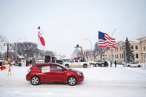Mike Sudoma / Winnipeg Free Press
A car in support of the Freedom Convoy drives past the protest now set up in Memorial Park Friday afternoon
February 18, 2022