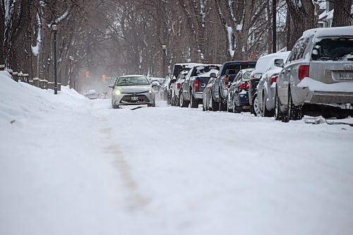 Mike Sudoma / Winnipeg Free Press
A car drives over the road ruts on Sherburn St Friday afternoon. 
February 18, 2022