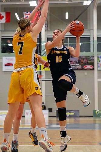 Brandon University Bobcats Adrianna Proulx takes a shot against the University of Manitoba Bisons Lovisa Fjellner in a Canada West women&#x573; basketball game at the Healthy Living Centre Friday. (Chelsea Kemp/The Brandon Sun)