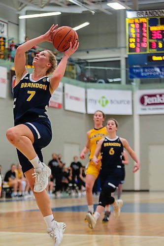 Brandon University Bobcats Reeta Tulkki completes a lay up against the University of Manitoba Bisons Emerson Martin in a Canada West women&#x573; basketball game at the Healthy Living Centre Friday. (Chelsea Kemp/The Brandon Sun)