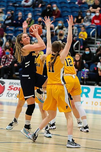 Brandon University Bobcats Adrianna Proulx lays up against the University of Manitoba Bisons Eden Tabin in a Canada West women&#x573; basketball game at the Healthy Living Centre Friday. (Chelsea Kemp/The Brandon Sun)