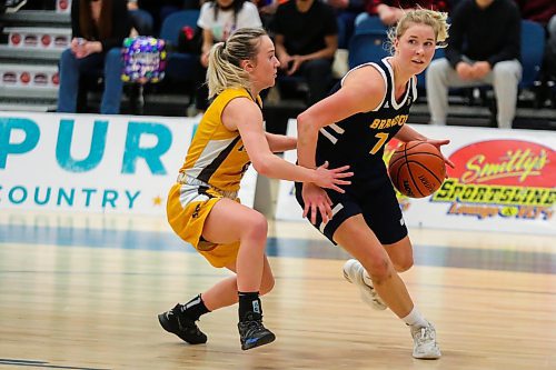 Brandon University Bobcats Reeta Tulkki drives past the University of Manitoba Bisons Lauren Bartlett in a Canada West women&#x573; basketball game at the Healthy Living Centre Friday. (Chelsea Kemp/The Brandon Sun)