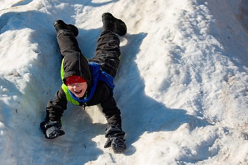 Gunner Erickson, 5, plays in a snow pile during Winter Fest at the Sportsplex Saturday. (Chelsea Kemp/The Brandon Sun)