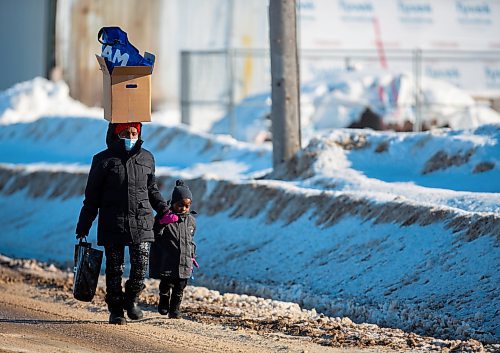 A women and her child walk down Pacific Avenue Wednesday. (Chelsea Kemp/The Brandon Sun)