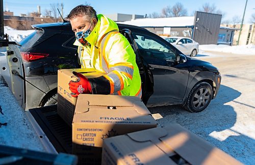 Ted Dzogan delivers eggs to customers outside the Brandon Neighbourhood Renewal Corporation Inc. Friday. The shipment of more than 200,000 affordably priced eggs was provided by Second Harvest  and co-ordinated by the Food Rescue Grocery Store. The eggs are $3 for a flat of 30 or $10 for a box of 180. The proceeds will cover the shipping, unloading and distribution costs associated with the eggs. They were available for pick-up on Friday and Saturday. (Chelsea Kemp/The Brandon Sun)