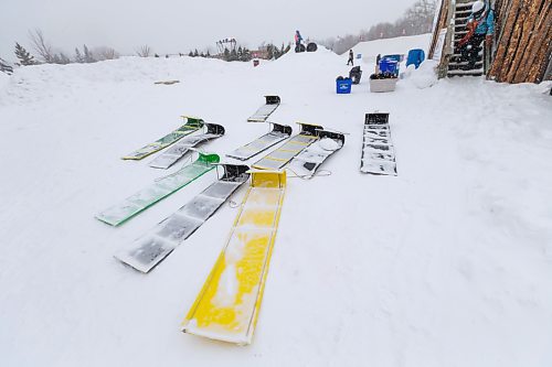 Daniel Crump / Winnipeg Free Press. Toboggans are available to be borrowed for use on the slide at Festival du Voyageur in Winnipeg. The Festival returns for the first time since prior to the pandemic. February 19, 2022.