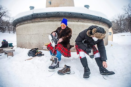 MIKAELA MACKENZIE / WINNIPEG FREE PRESS

Dwight MacAulay (left) and Peter Heavysege lace up for the Great Canadian Kilt Skate, put on by the St. Andrew&#x573; Society of Winnipeg, at The Forks in Winnipeg on Monday, Feb. 21, 2022. Last year Winnipeg won the national title as kilt skate capital of Canada. Standup.
Winnipeg Free Press 2022.