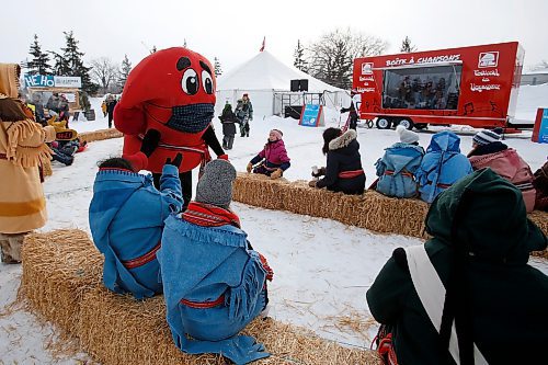 JOHN WOODS / WINNIPEG FREE PRESS
A mascot gives high-fives as people watch a band play at the Festival du Voyageur, Monday, February 21, 2022. weekend.

Re: standup