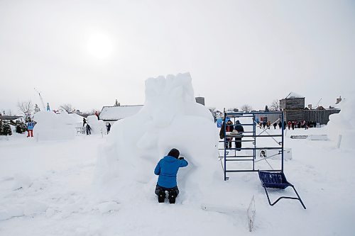 JOHN WOODS / WINNIPEG FREE PRESS
An artist works on the End Of The Caribou snow sculpture at the Festival du Voyageur, Monday, February 21, 2022. weekend.

Re: standup