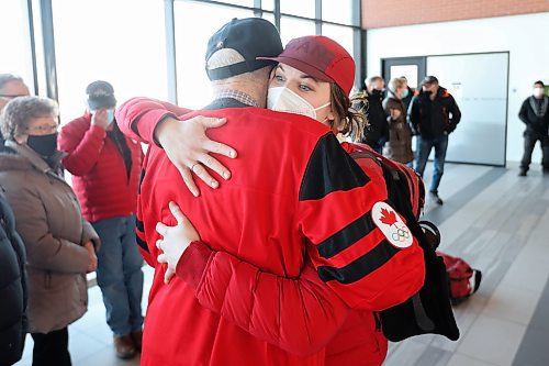 22022022
Local Olympian Kristen Campbell hugs her grandfather Bill Miller after arriving at the Brandon Municipal Airport on Tuesday. Campbell won a gold medal as part of Team Canada's women's hockey team at the Olympic Games Beijing 2022. 
(Tim Smith/The Brandon Sun)
