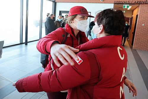 22022022
Local Olympian Kristen Campbell hugs her mother Janet Campbell after arriving at the Brandon Municipal Airport on Tuesday. Campbell won a gold medal as part of Team Canada's women's hockey team at the Olympic Games Beijing 2022. A group of family and supporters welcomed her home at the airport. 
(Tim Smith/The Brandon Sun)