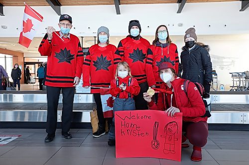 22022022
Local Olympian Kristen Campbell takes photos at the Brandon Municipal Airport with family and supporters along with her gold medal that she won as part of Team Canada's women's hockey team at the Olympic Games Beijing 2022. 
(Tim Smith/The Brandon Sun)