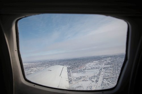 JESSICA LEE / WINNIPEG FREE PRESS

February 16, 2022: The view from above Winnipeg is spectacular. I miss travelling like the way we did before the pandemic. This flight gives me incredible nostalgia. I haven&#x2019;t left the country since March 2020.