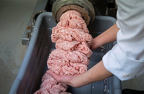 JESSICA LEE / WINNIPEG FREE PRESS
Michelle Mansell, owner, grinds pork at Frig’s Natural Meats on February 22, 2022.
Reporter: Dave