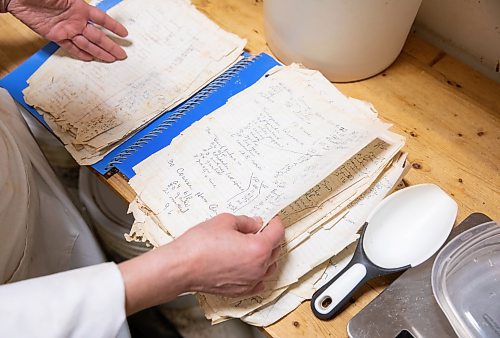 JESSICA LEE / WINNIPEG FREE PRESS

Michelle Mansell, owner, browses the recipe book at Frig&#x2019;s Natural Meats on February 22, 2022.

Reporter: Dave
